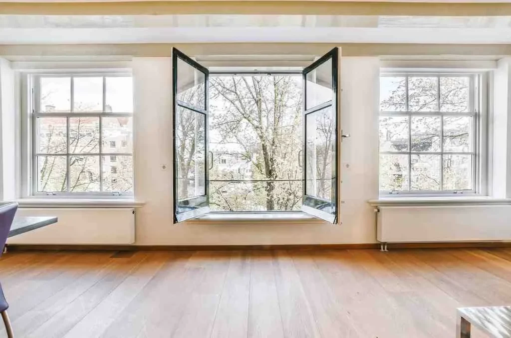 How Long Do Double Glazed Windows Last: Modern double glazed windows in a bright home interior showing energy-efficient window design and long-lasting performance.