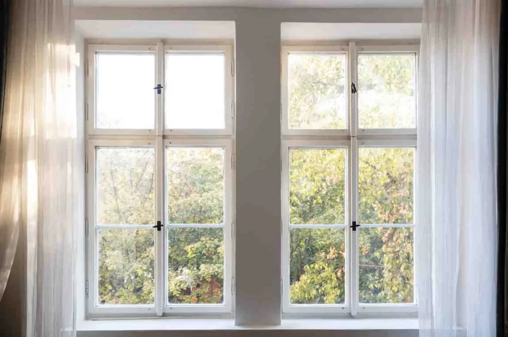 French windows with full-height glazed panels providing natural light, double opening design, and energy-efficient performance for modern UK homes